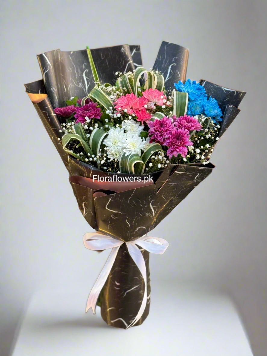 A bouquet of flowers consisting of Chrysanthemums and Baby's Breath, with premium wrapping sheets and a white ribbon.