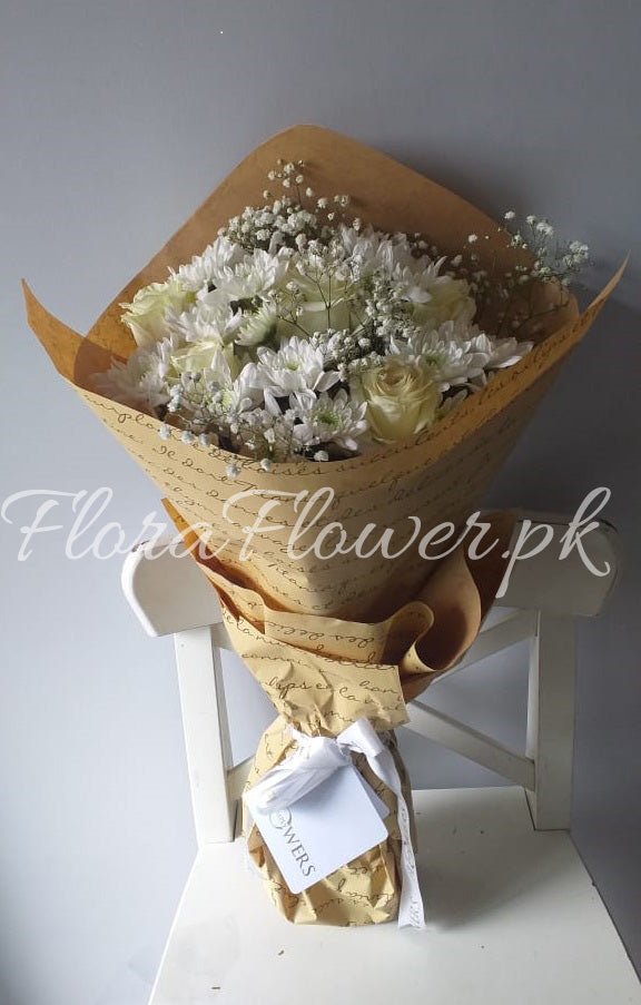 A bouquet of flowers consisting of roses, chrysanthemums, and baby's breath, wrapped in premium wrapping paper.