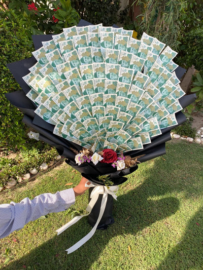 Large number of green and white cards arranged in a circular pattern on a stand outdoors. Send flowers to islamabad. send flowers to pakistan