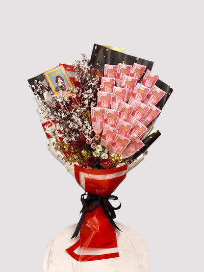 A bouquet arrangement made of banknotes and artificial flowers, wrapped with red and white paper and tied with a ribbon. Send flowers to islamabad. send flowers to pakistan